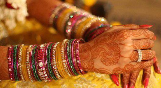 A bride wearing Glass Bangles