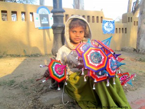 Kid glittering with Colorful Umbrellas designed by her Father