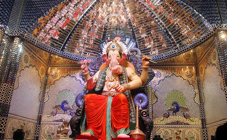 Lalbaugcha Raja stands tall: This 80 plus year old Ganpati pandal in Mumbai's Lalbaug attracts massive crowds each year. Devotees wait for hours and sometimes days in queues to get a glimpse of their beloved god. (Image: Firstpost.com)